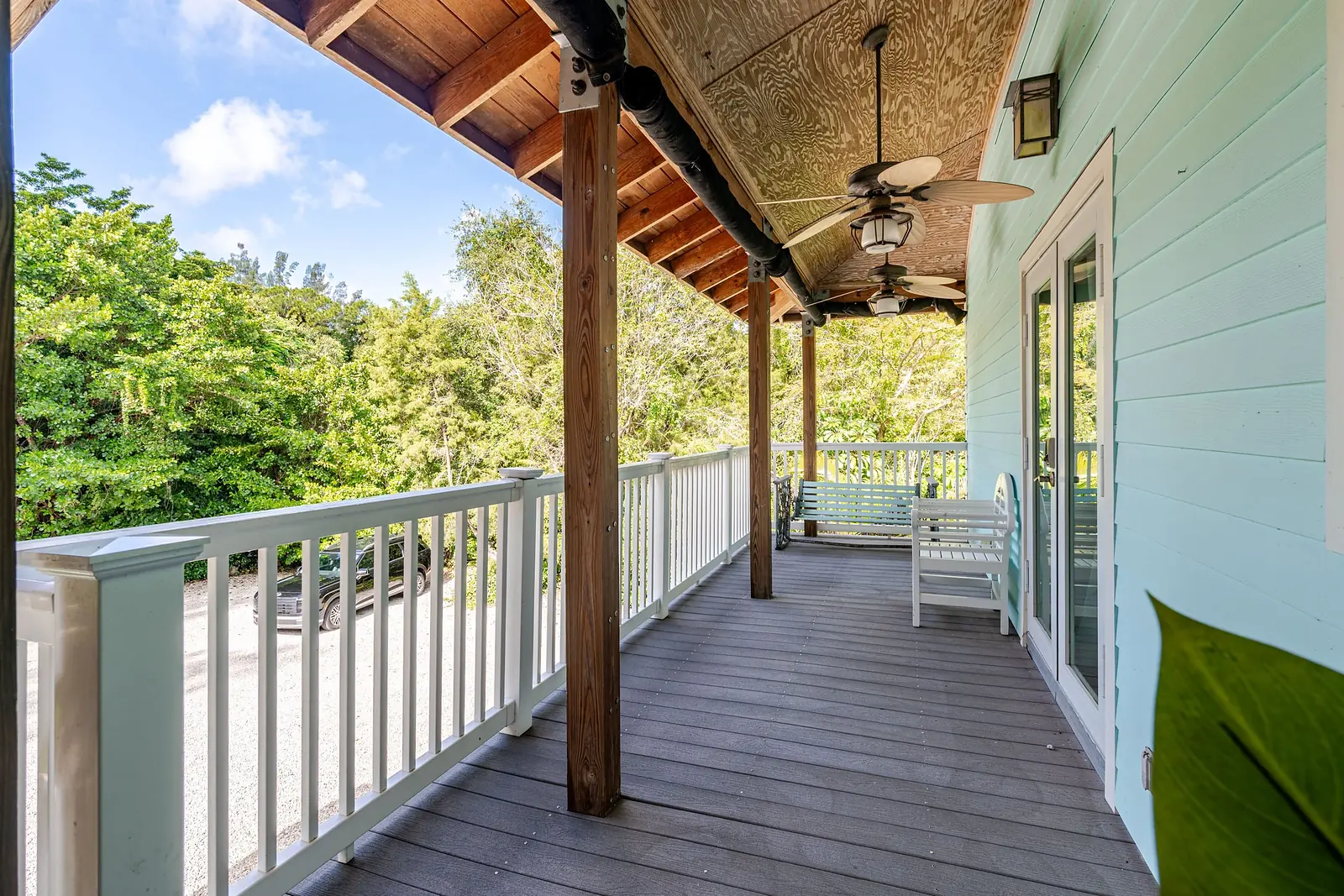Covered upper porch with ceiling fans