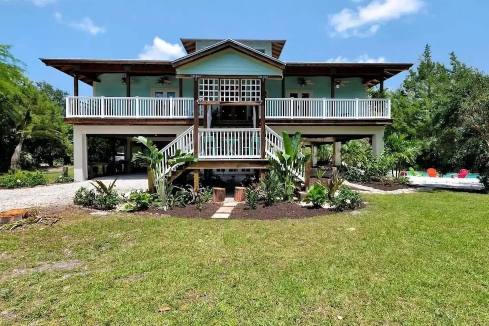 Front lawn and the two-story porches of the house