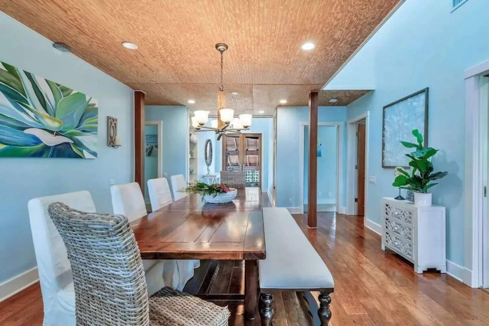 Dining table for 10 under a wood ceiling