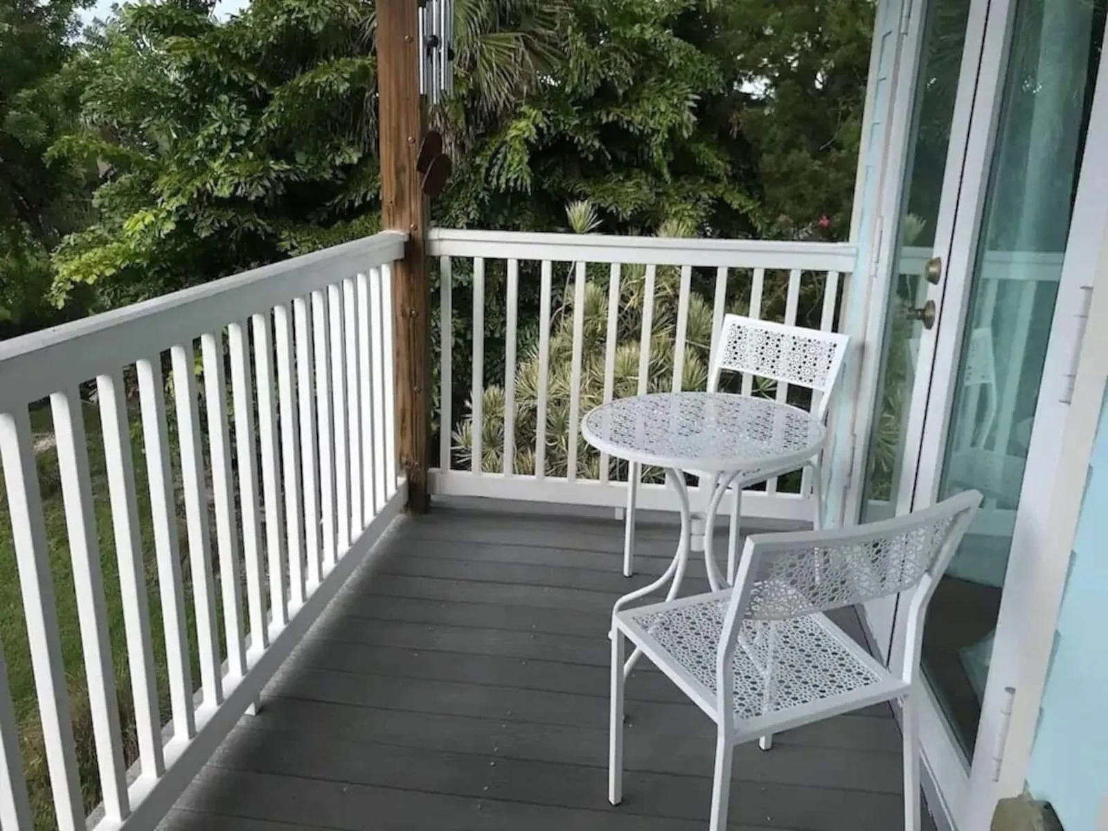 Master bedroom balcony with a bistro table