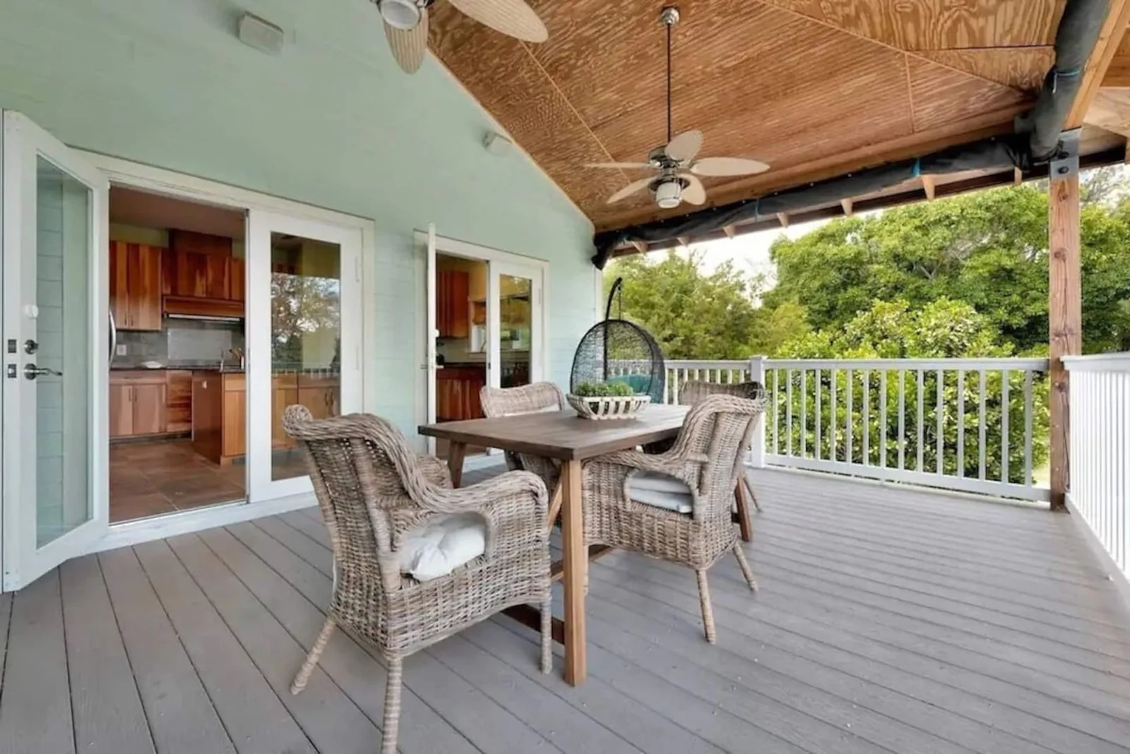 Big balcony off the kitchen with a dining table
