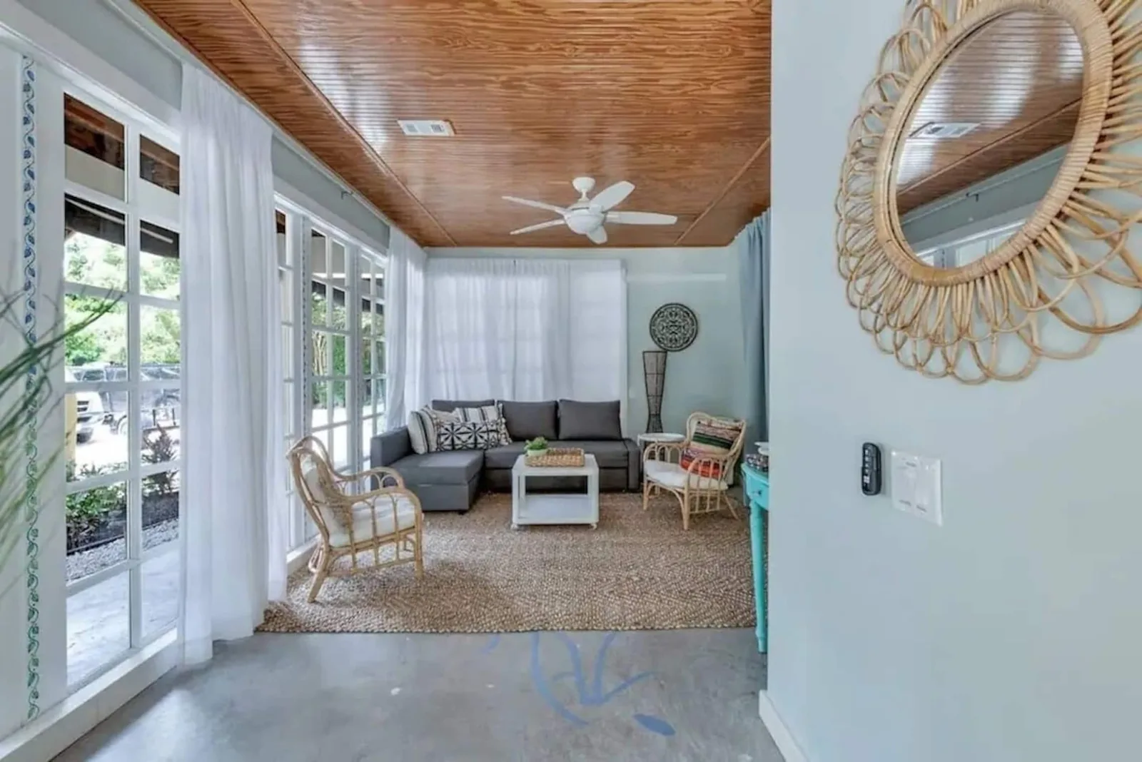 Downstairs suite sunroom with a queen sofa bed