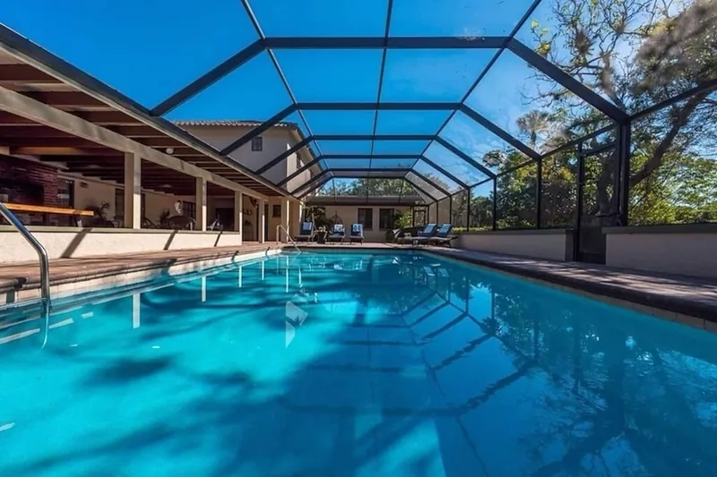 Screened pool beside the covered lanai