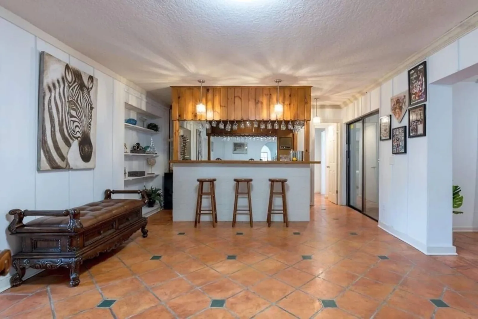 Bar with stools and terracotta floors