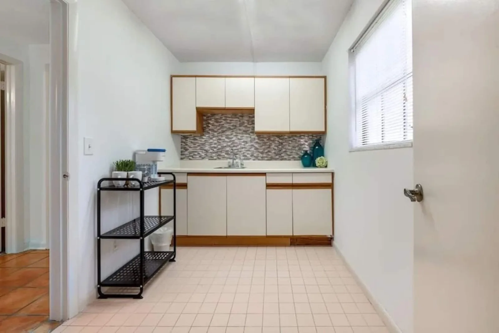 Small kitchenette by the fourth bedroom, with a sink