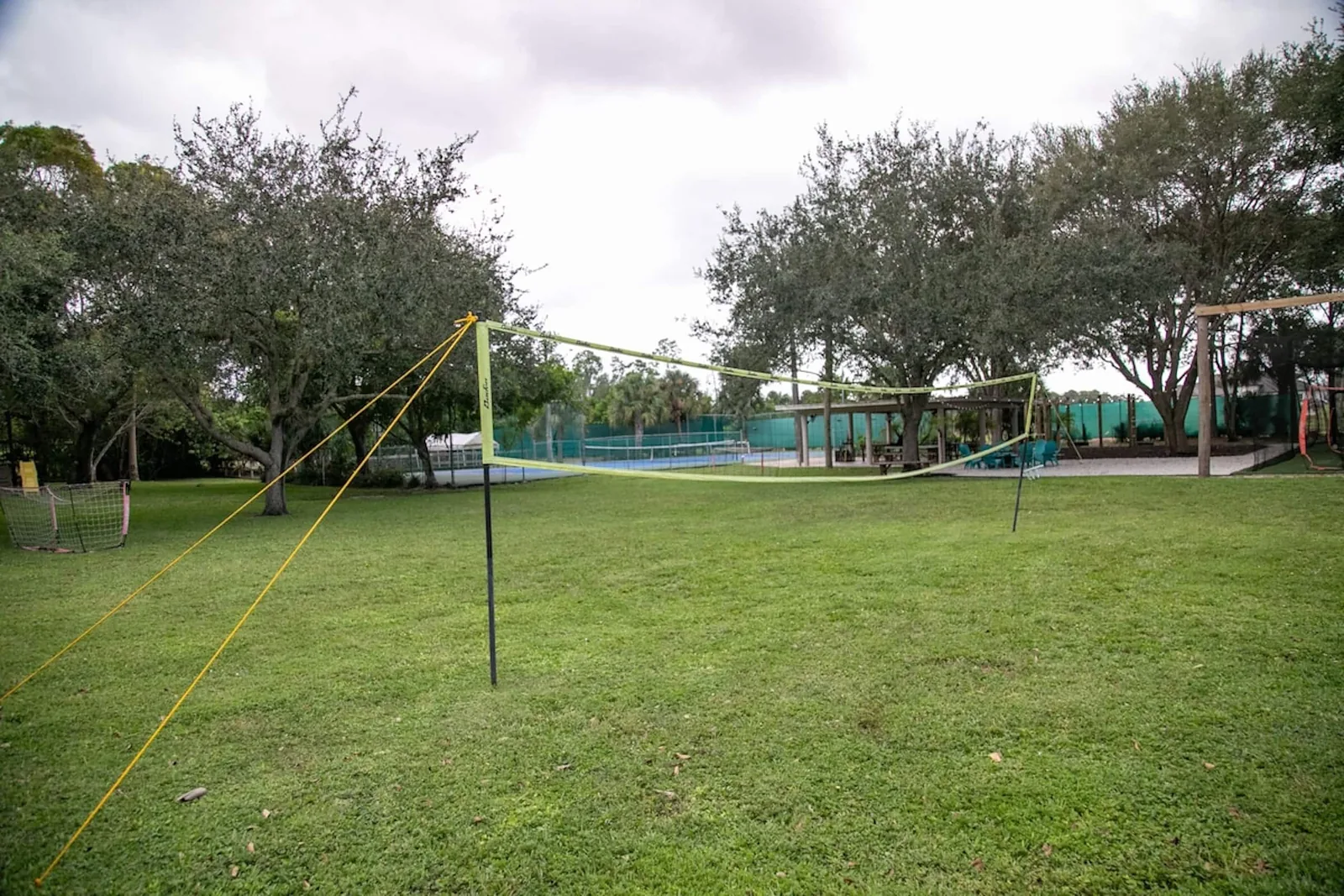 Volleyball net strung across the lawn
